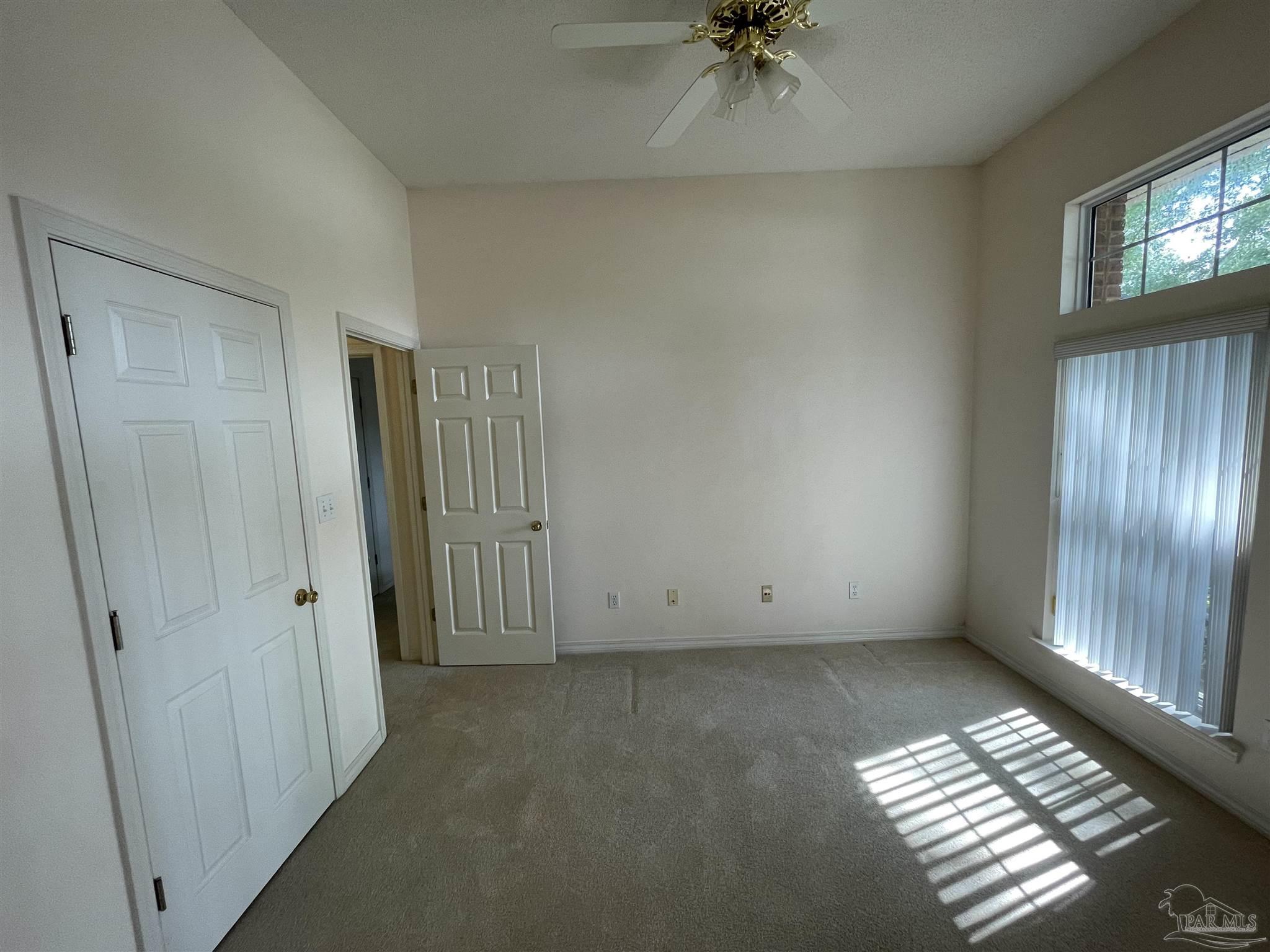 941 Spring Creek Circle Pensacola, FL 32514 - Photo 19 of 30 an empty room with windows and fan