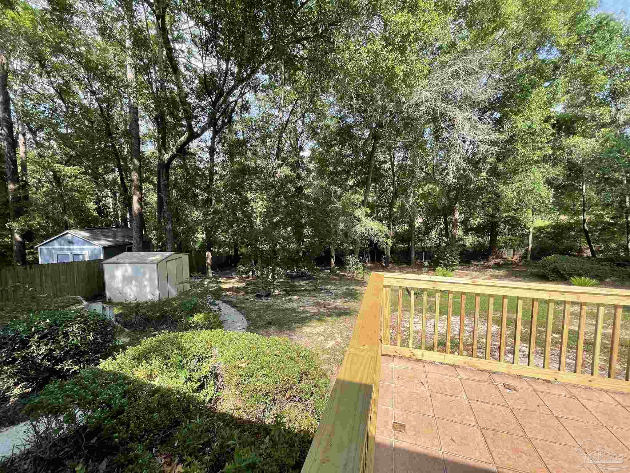 941 Spring Creek Circle Pensacola, FL 32514 - Photo 25 of 30 a view of a swimming pool with a patio and yard