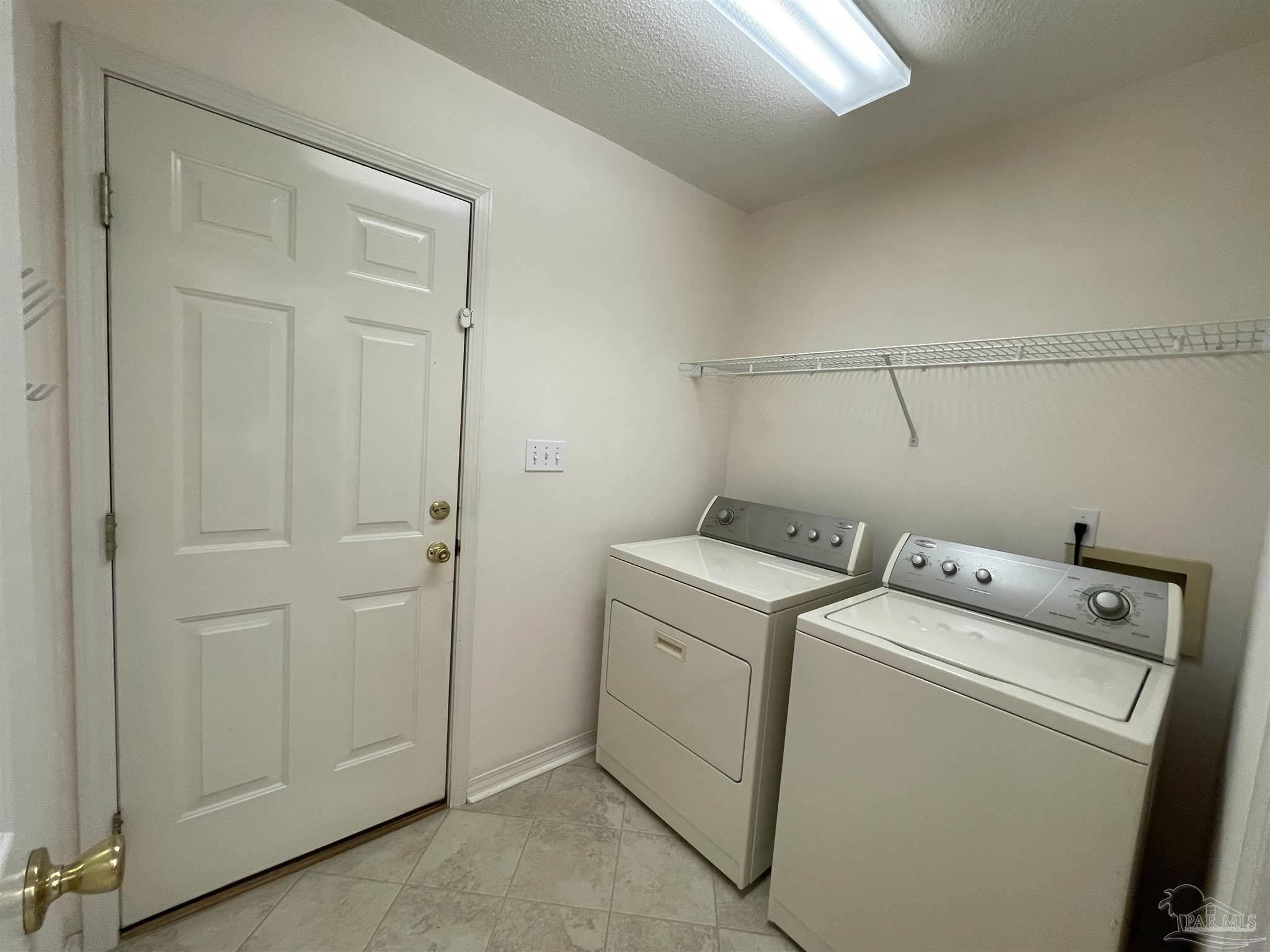 941 Spring Creek Circle Pensacola, FL 32514 - Photo 28 of 30 a utility room with dryer and washer