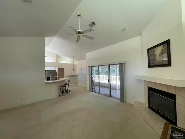 a view of livingroom with hardwood floor and a ceiling fan