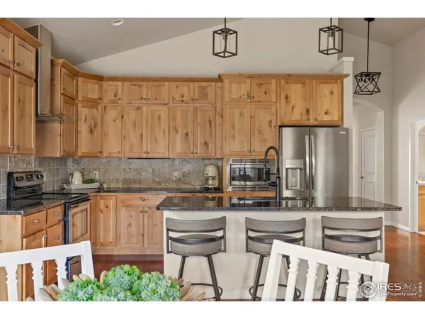 a kitchen with stainless steel appliances a sink and cabinets