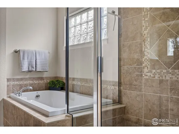 a bathroom with a tub and shower