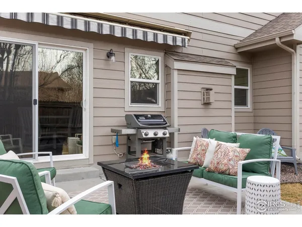 a view of a patio with couches table and chairs