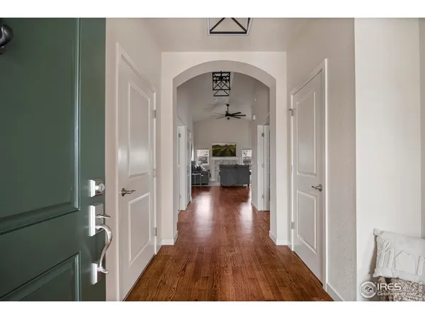 a view of hallway with wooden floor