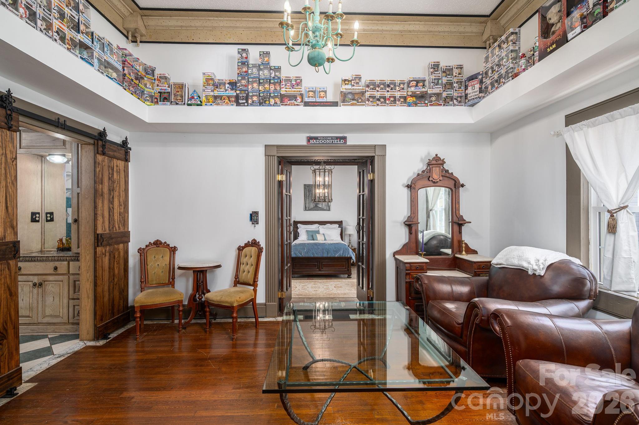 1387 George Brown Road Crouse, NC 28033 - Photo 23 of 48 a living room with furniture and a chandelier