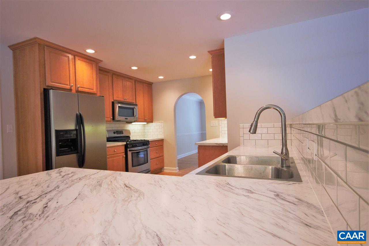 28 Zephyr Road Palmyra, VA 22963 - Photo 2 of 20 a kitchen with stainless steel appliances kitchen island granite countertop a sink a stove and refrigerator