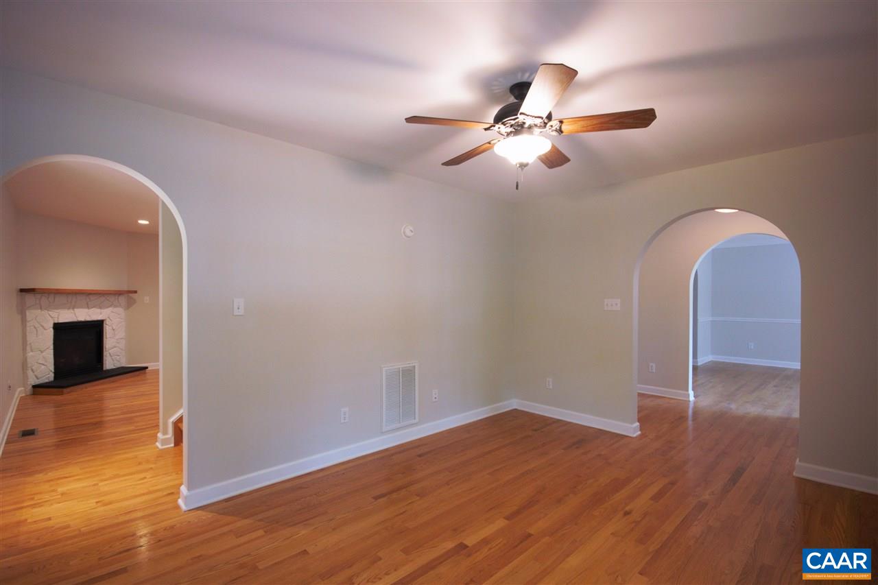 28 Zephyr Road Palmyra, VA 22963 - Photo 5 of 20 an empty room with wooden floor fan and windows