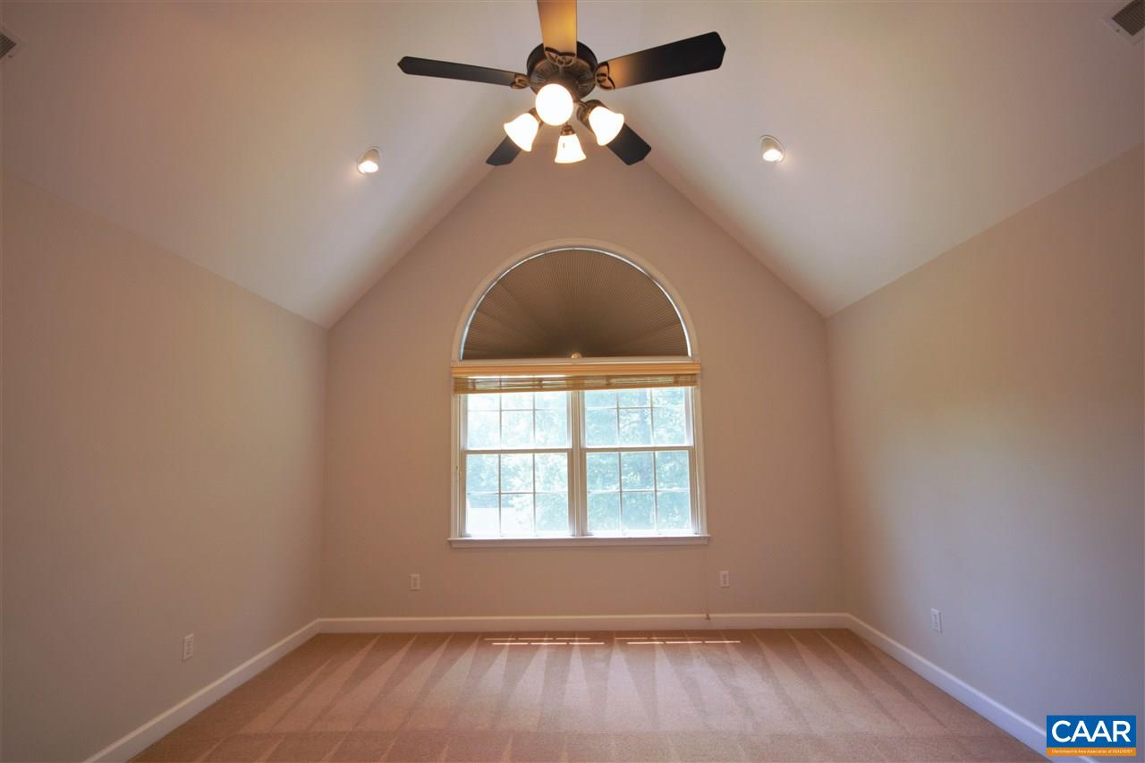 28 Zephyr Road Palmyra, VA 22963 - Photo 10 of 20 an empty room with wooden floor chandelier fan and window