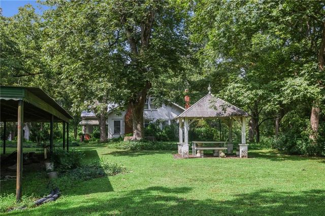 a view of backyard with green space