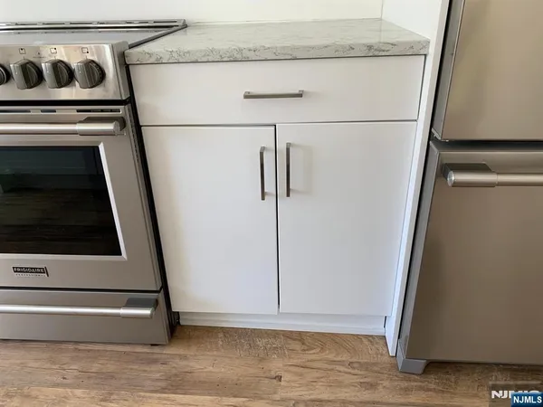 a view of a storage and utility room with washer and dryer