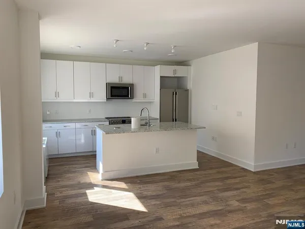 a room with a cabinets and a wooden floor