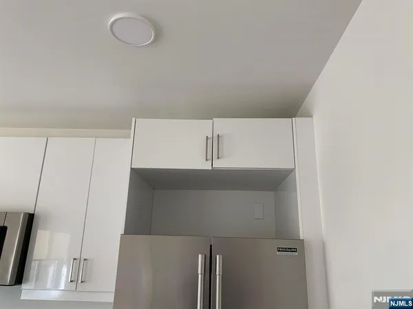 a refrigerator freezer sitting in a kitchen