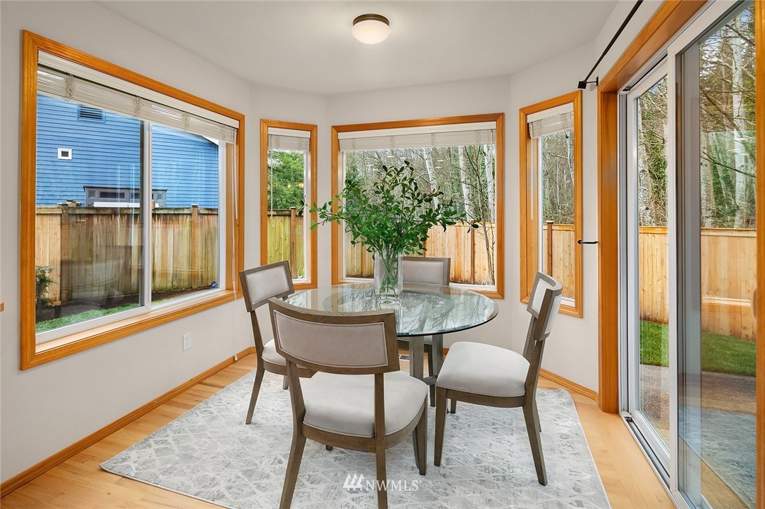 24204 18th Place West Bothell, WA 98021 - Photo 15 of 28 a dining room with furniture and wooden floor
