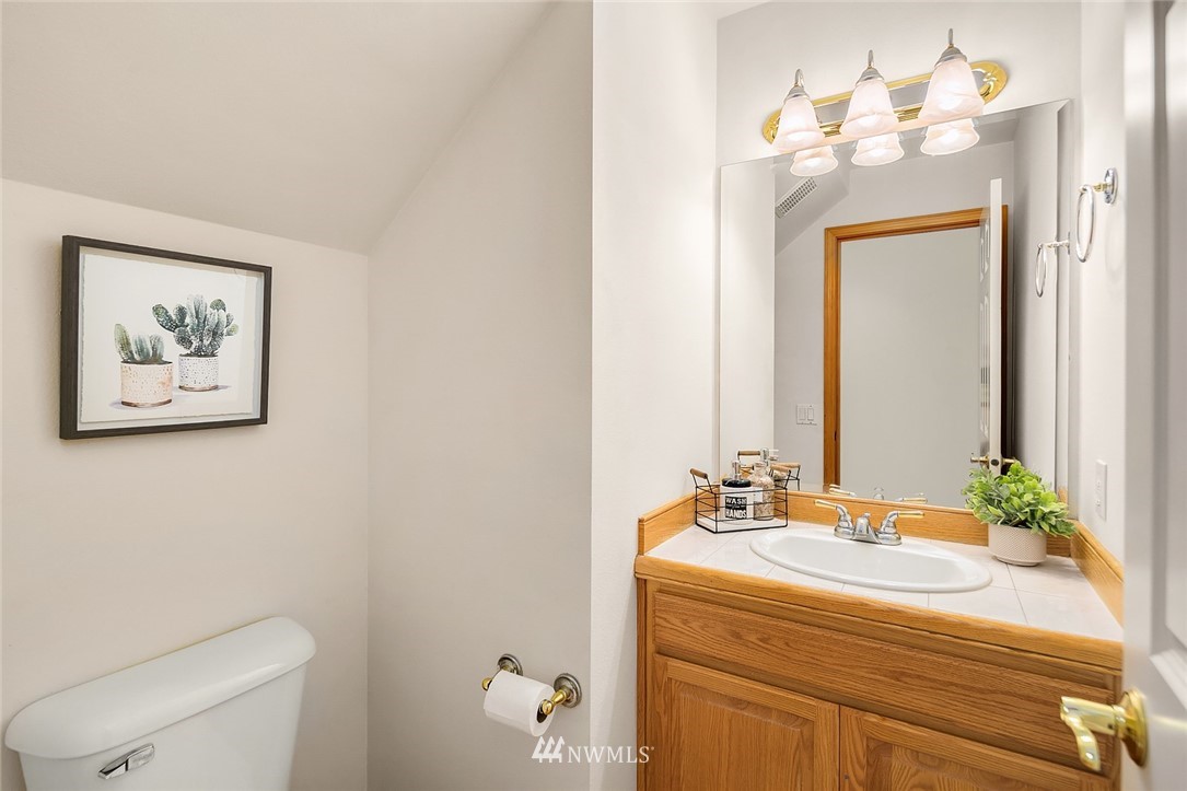 24204 18th Place West Bothell, WA 98021 - Photo 17 of 28 a bathroom with a sink vanity and a mirror
