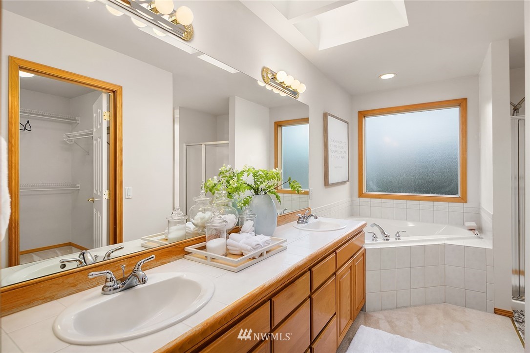 24204 18th Place West Bothell, WA 98021 - Photo 20 of 28 a bathroom with a granite countertop sink mirror and a