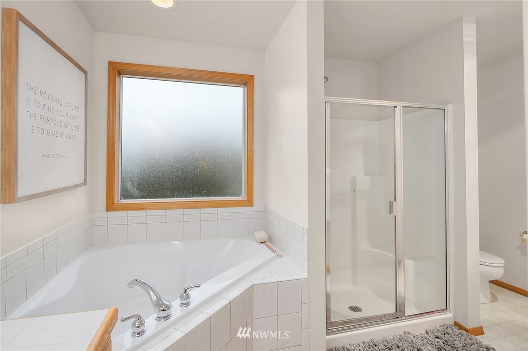 24204 18th Place West Bothell, WA 98021 - Photo 21 of 28 a bathroom with a bathtub and shower
