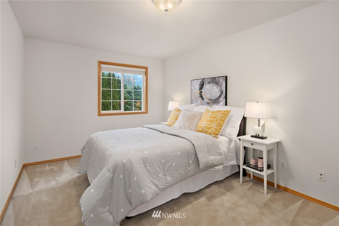 24204 18th Place West Bothell, WA 98021 - Photo 23 of 28 a bedroom with a bed and a window