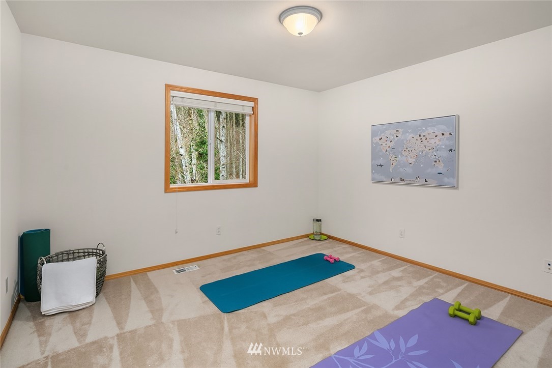 24204 18th Place West Bothell, WA 98021 - Photo 24 of 28 a room with a bed and a couch