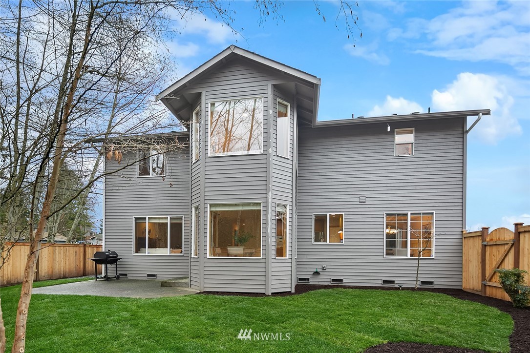 24204 18th Place West Bothell, WA 98021 - Photo 26 of 28 a front view of a house with a yard