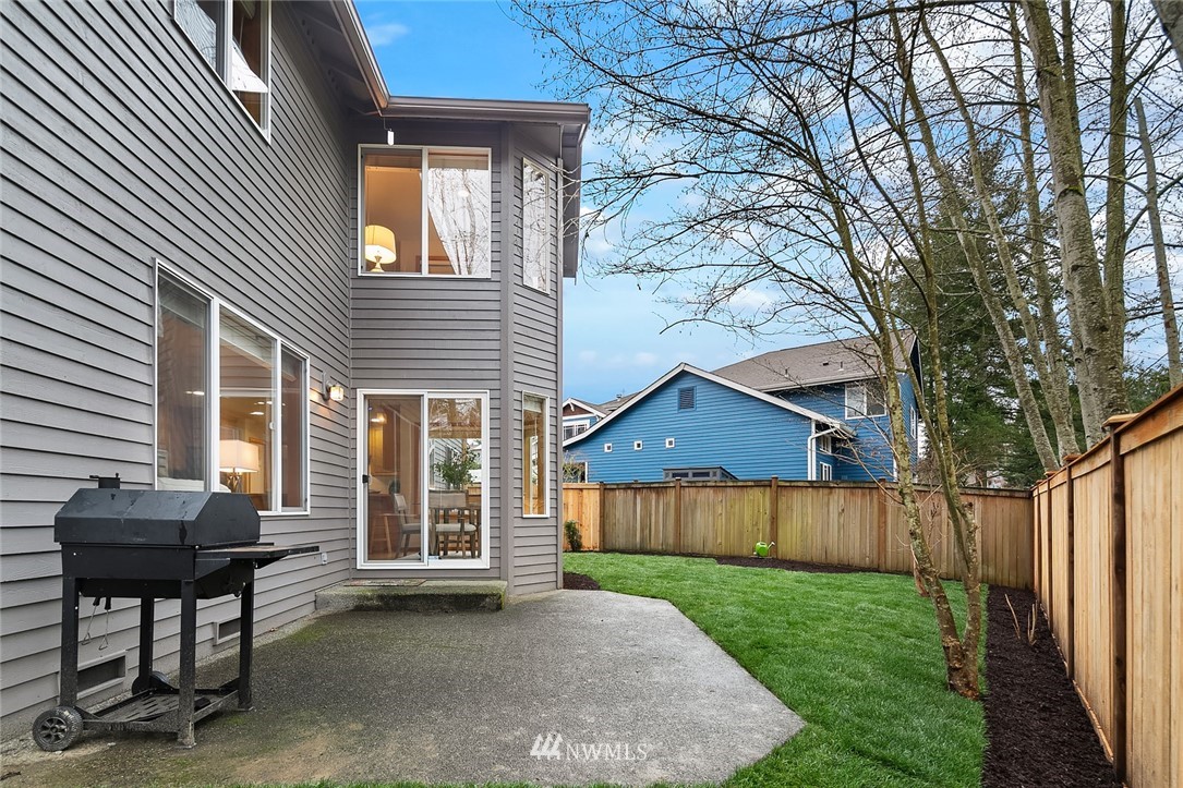24204 18th Place West Bothell, WA 98021 - Photo 27 of 28 a view of a house with backyard and a tree