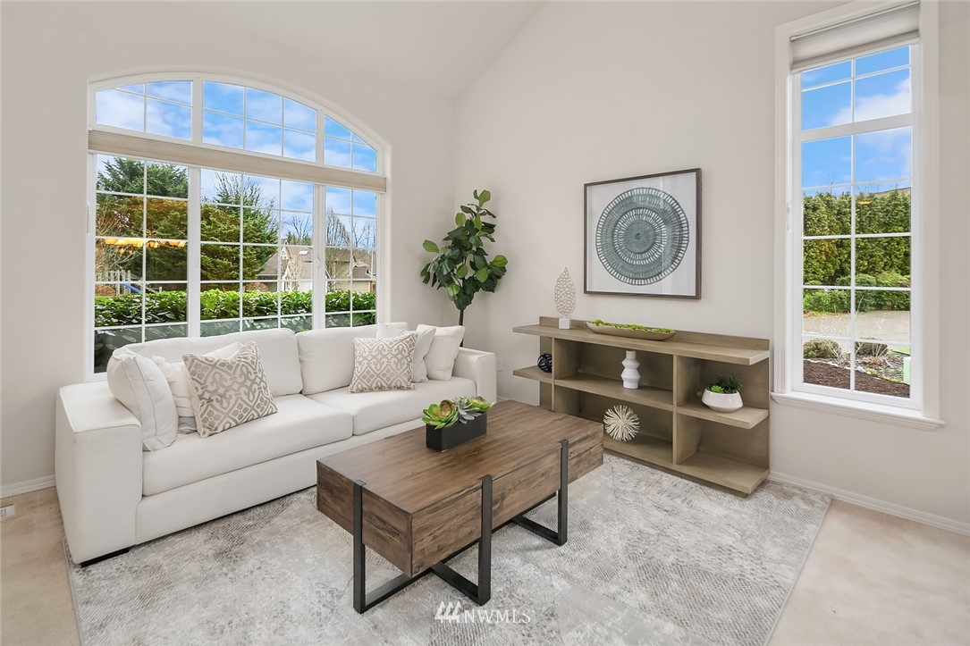 24204 18th Place West Bothell, WA 98021 - Photo 5 of 28 a living room with furniture a window and a fireplace