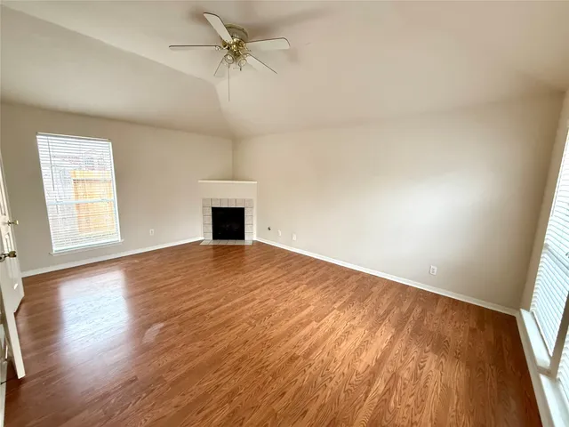 a large kitchen with kitchen island granite countertop a large window and a counter space