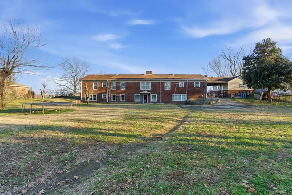 a view of a house with a big yard