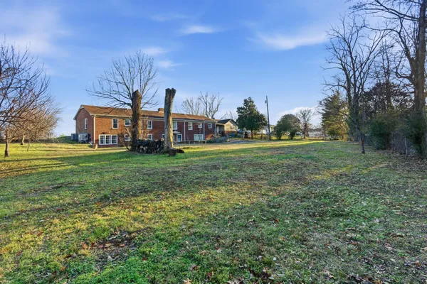 a large building with trees in front of it