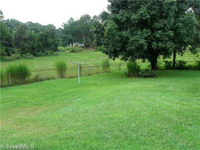 208 Collins Road Madison, NC 27025 - Photo 9 of 16 Land. Back yard with view of Pasture