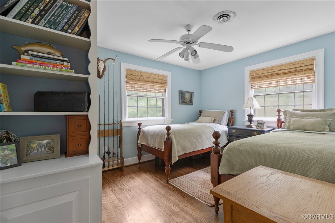 4233 Waumsetta Road Richmond, VA 23235 - Photo 11 of 32 a bedroom with two beds and a window