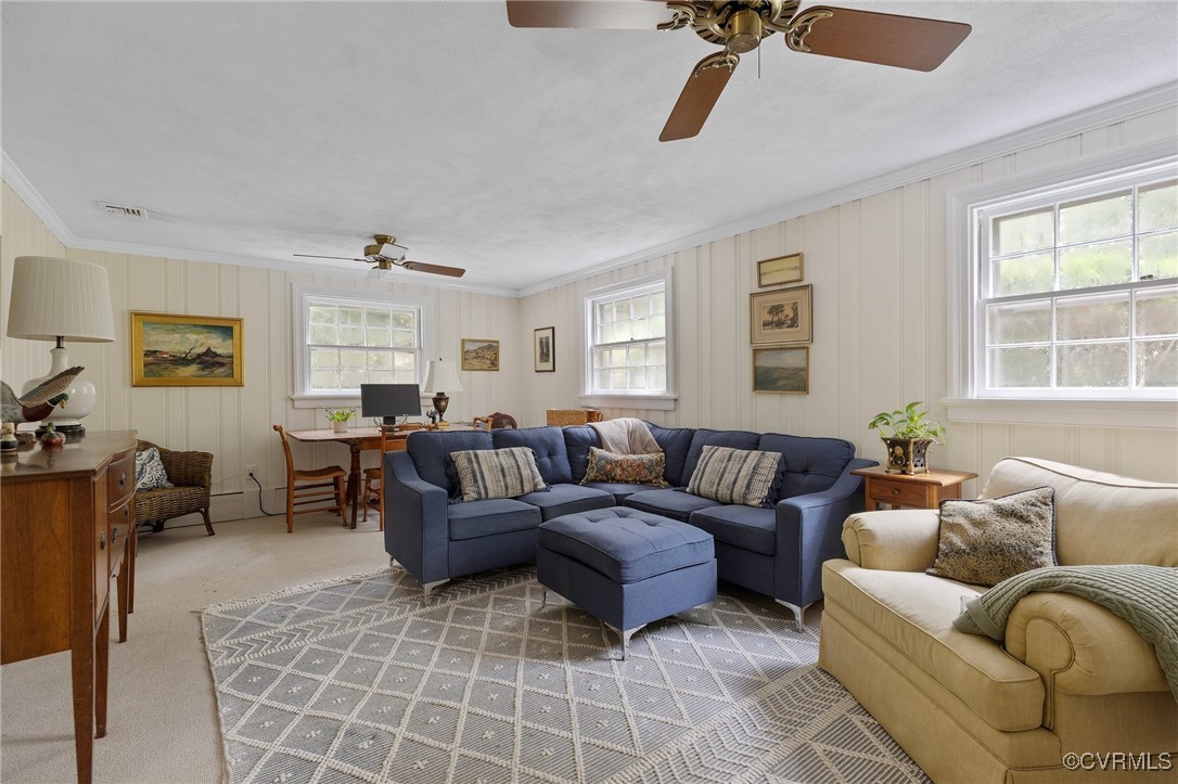4233 Waumsetta Road Richmond, VA 23235 - Photo 14 of 32 a living room with furniture ceiling fan and a window