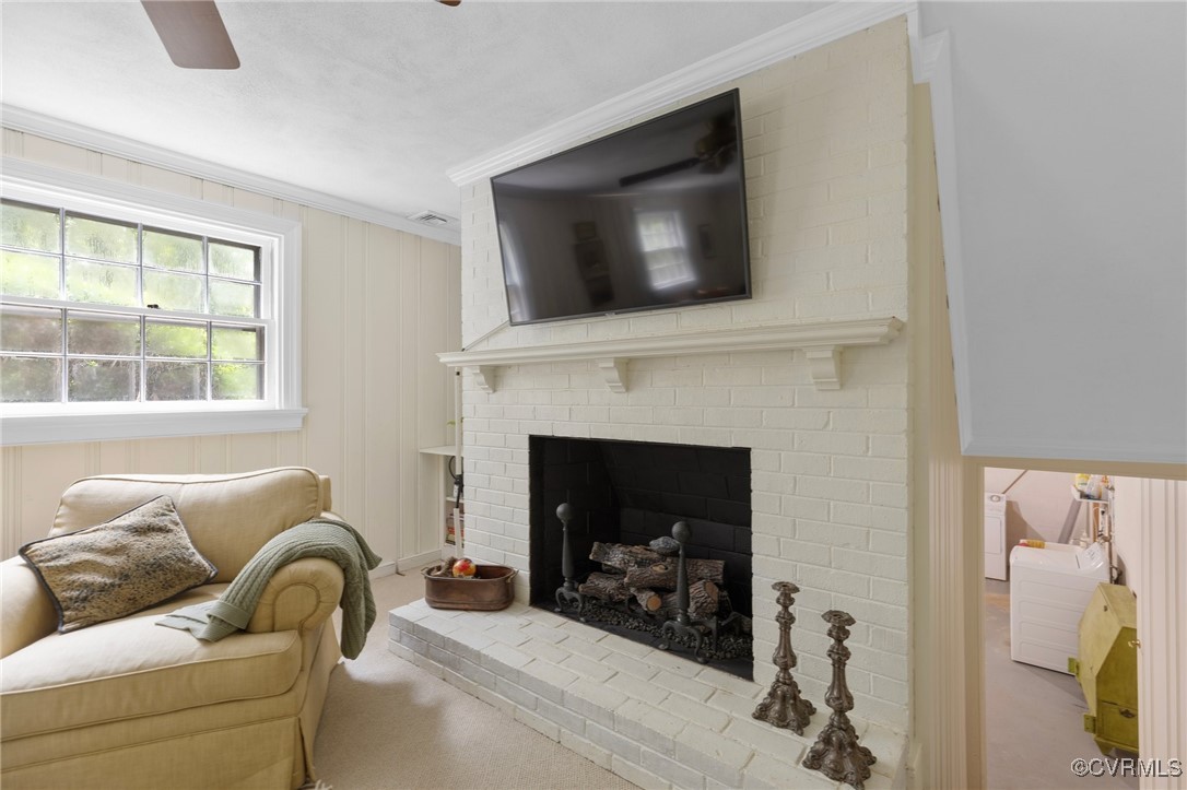 4233 Waumsetta Road Richmond, VA 23235 - Photo 16 of 32 a living room with furniture and a fireplace