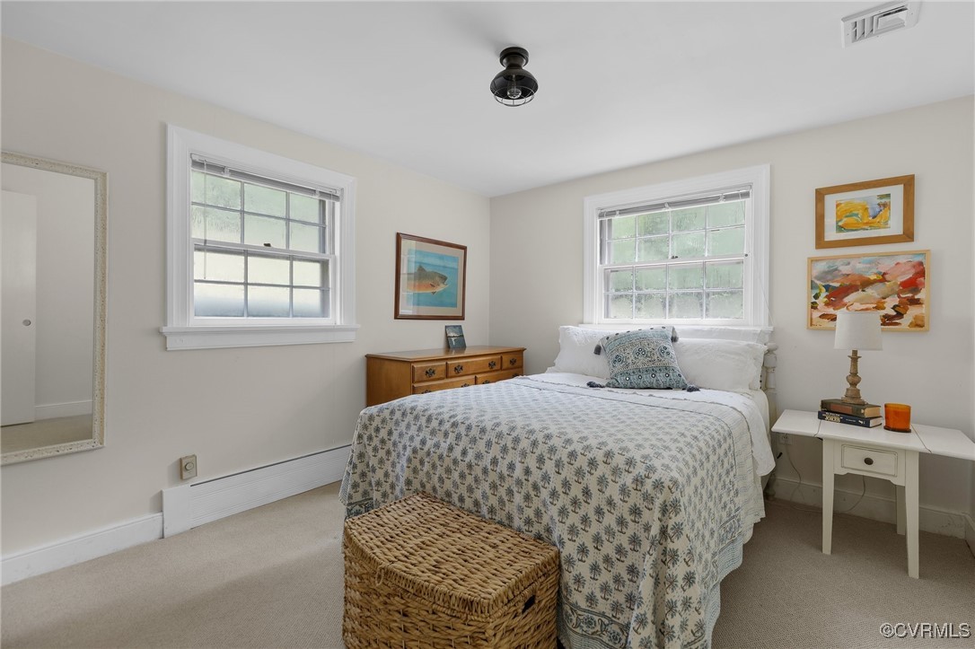 4233 Waumsetta Road Richmond, VA 23235 - Photo 18 of 32 a bedroom with a bed and a window