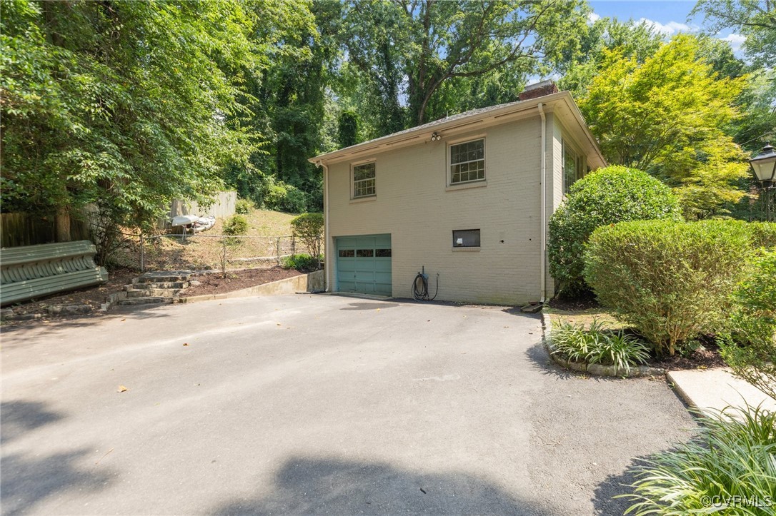 4233 Waumsetta Road Richmond, VA 23235 - Photo 27 of 32 a view of a house with a yard
