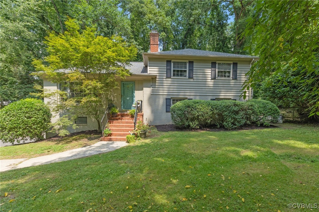 4233 Waumsetta Road Richmond, VA 23235 - Photo 32 of 32 a view of a house with a yard and sitting area