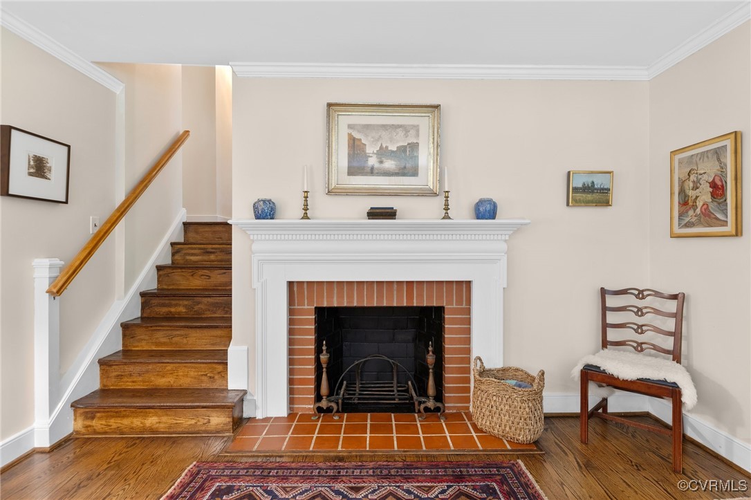 4233 Waumsetta Road Richmond, VA 23235 - Photo 9 of 32 a living room with wooden floor and a fireplace