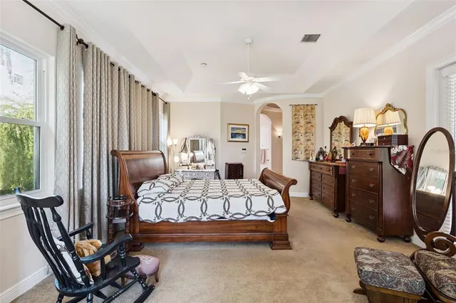 a bedroom with a bed and a dresser in it