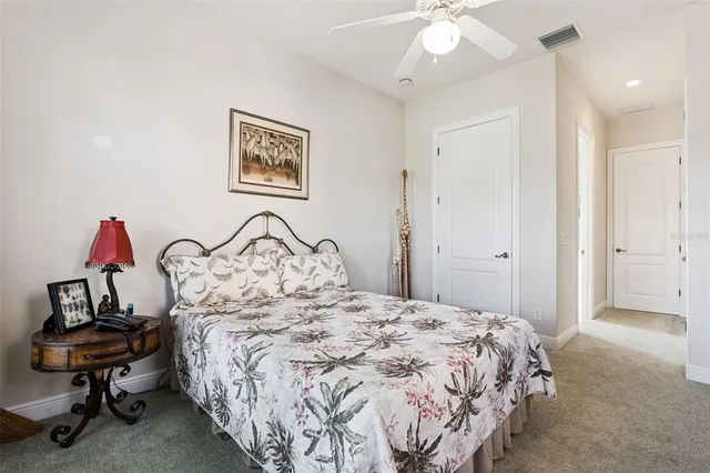 a bedroom with bed and a window