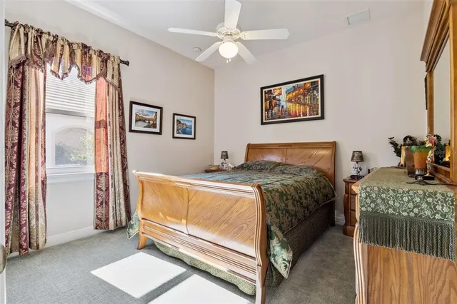 a bathroom with a sink a toilet and shower curtain