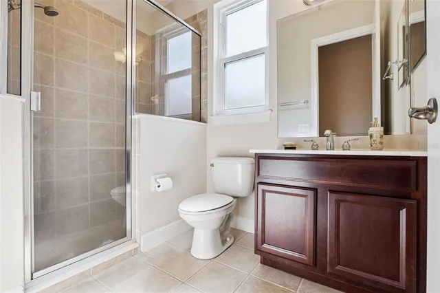 a living room with furniture and a book shelf