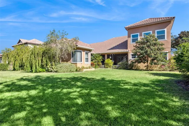an aerial view of residential building and lake