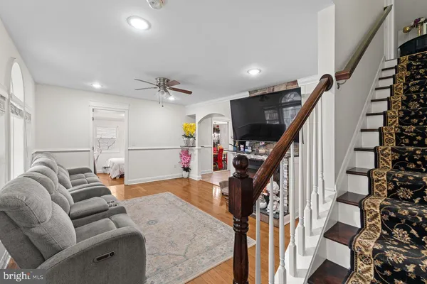 a kitchen with stainless steel appliances granite countertop a stove refrigerator and a microwave