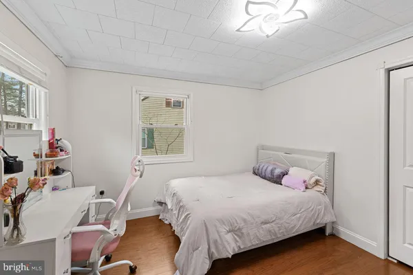 a bed room with a bed and a flat screen tv