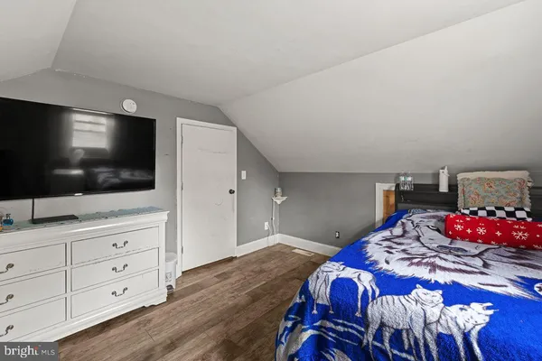 a view of swimming pool with outdoor seating and house in the background