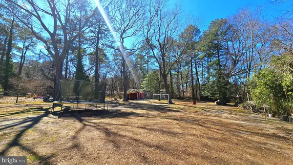 a view of a house with snow on the road