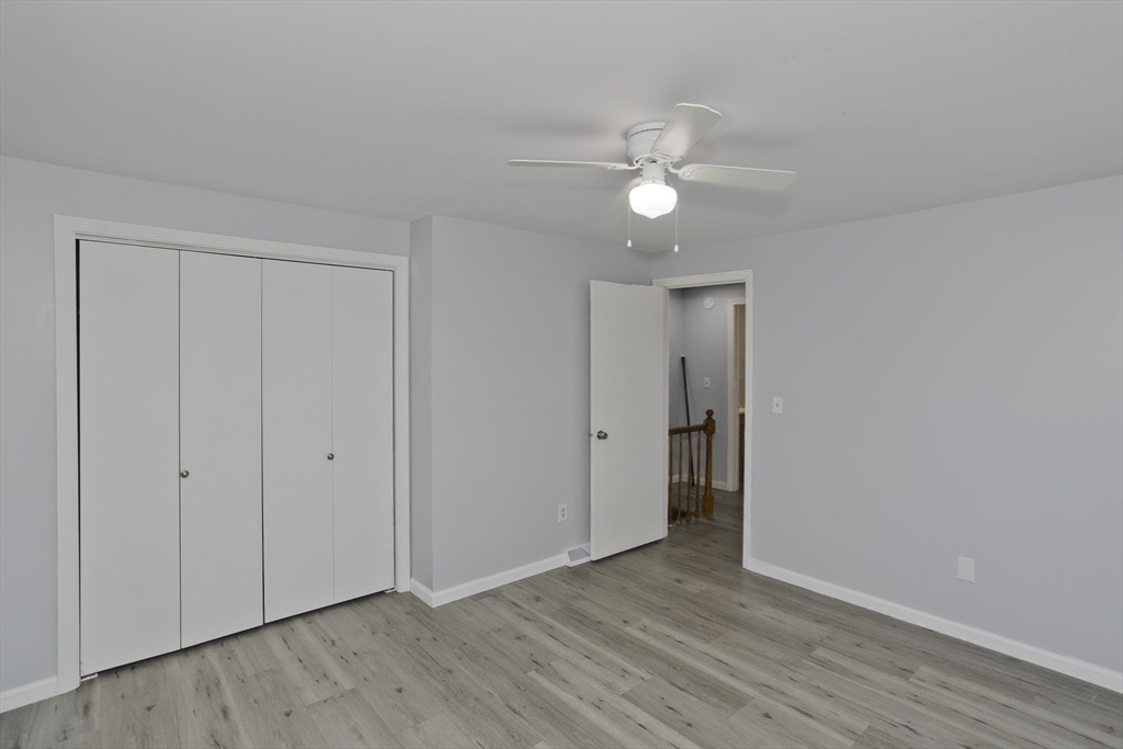 37-39 Porter Street Springfield, MA 01104 - Photo 16 of 40 a view of an empty room with wooden floor