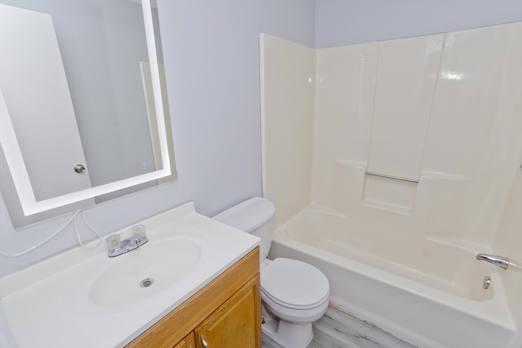 37-39 Porter Street Springfield, MA 01104 - Photo 18 of 40 a bathroom with a sink and a toilet