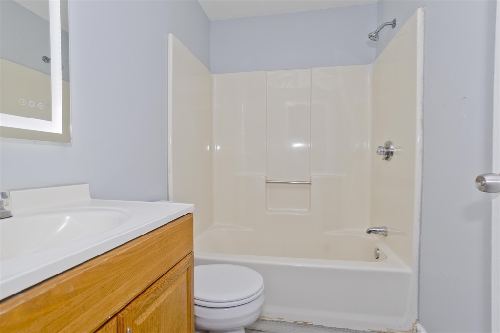 37-39 Porter Street Springfield, MA 01104 - Photo 19 of 40 a bathroom with a sink a toilet and shower