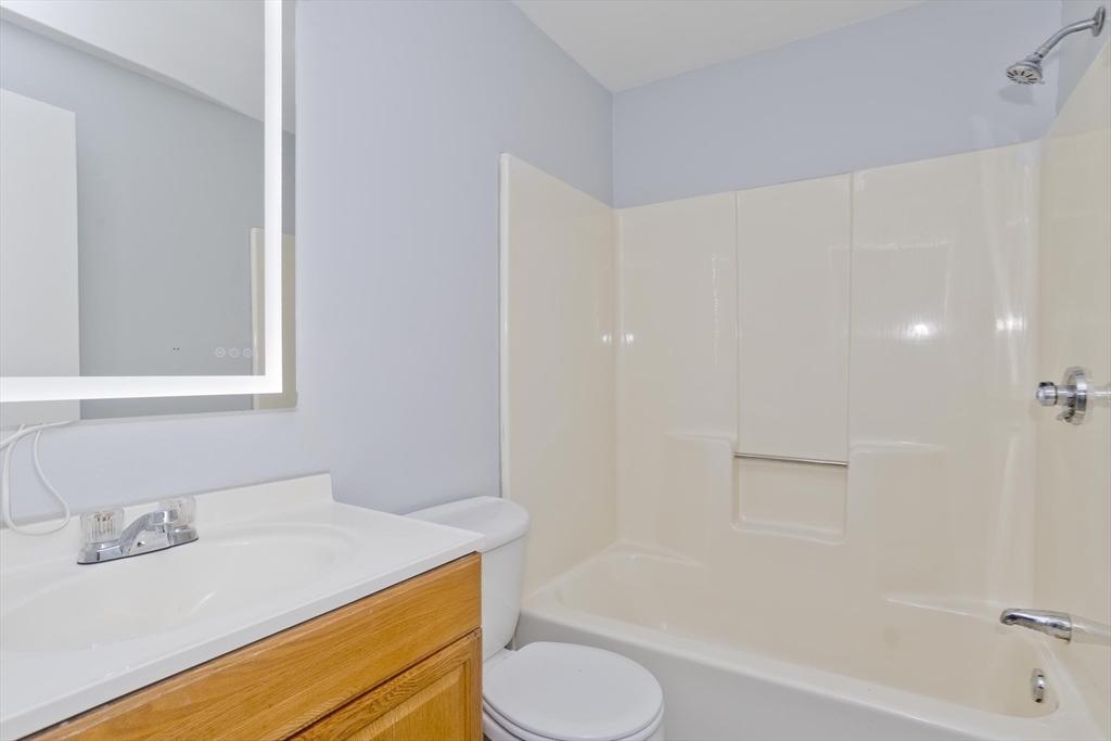 37-39 Porter Street Springfield, MA 01104 - Photo 20 of 40 a bathroom with a sink toilet and shower