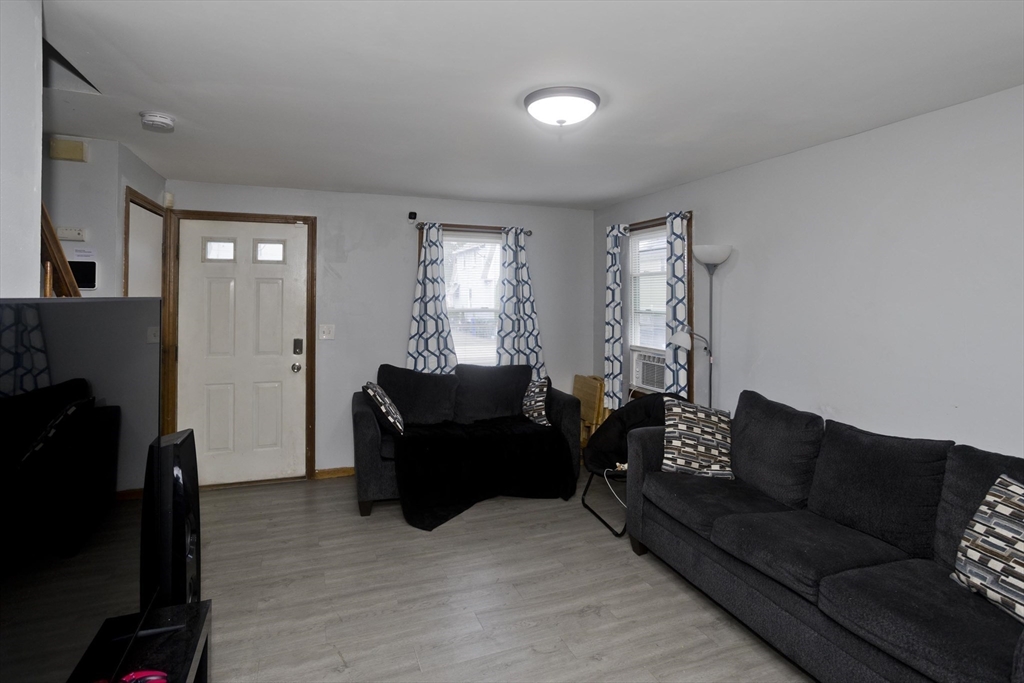 37-39 Porter Street Springfield, MA 01104 - Photo 26 of 40 a living room with furniture and a flat screen tv